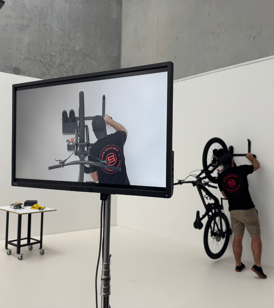 Behind the scenes at a product shoot here a person is adding GearMate components to the set up.