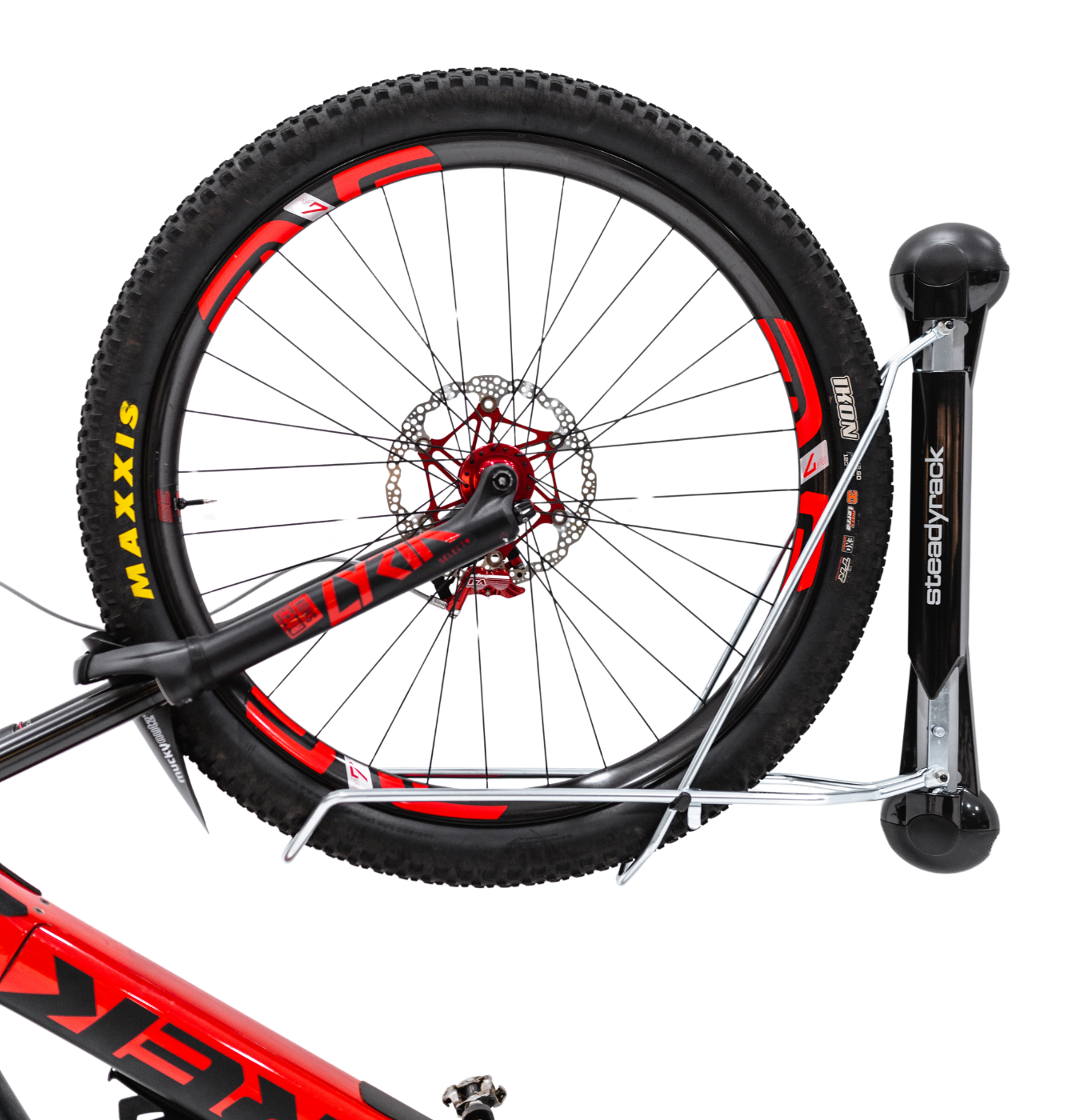 A close up side view shot of a mountain bike front tyre stored in a Steadyrack bike rack.