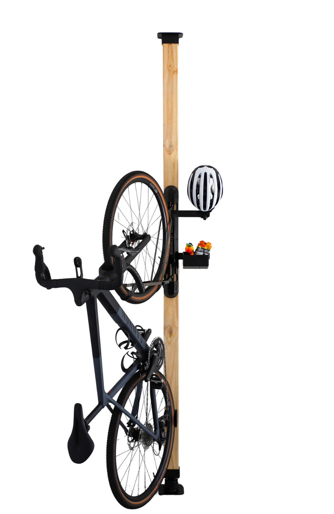 Bicycle mounted on a vertical bike rack on a wooden post with a helmet and tools attached.